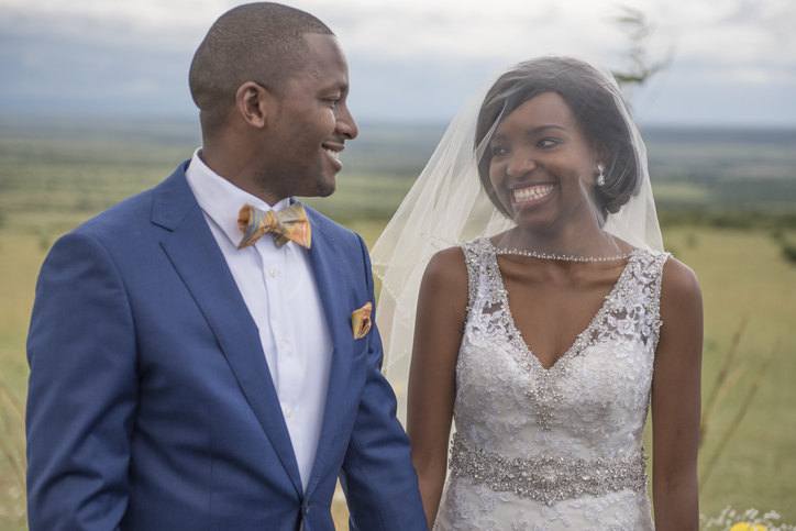 Smiling Bride and Groom Looking into Each Other's Eyes During Wedding Ceremony