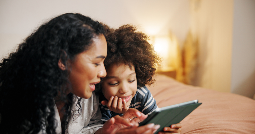 Home, mother and boy with tablet, smile and bonding together with bedroom, relaxing and social media. Family, apartment and parent with mama, child and tech with entertainment, help and connection