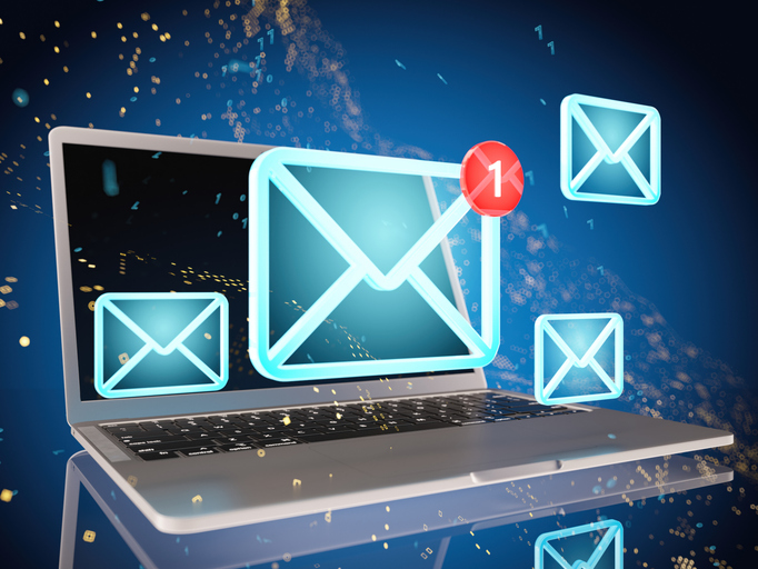 You've Got Mail. E-mail Icons over a Laptop
